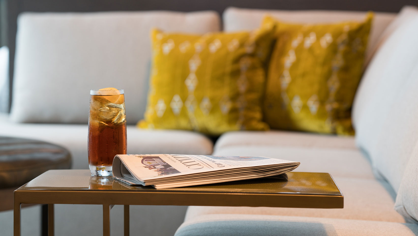 tea and newspaper on table