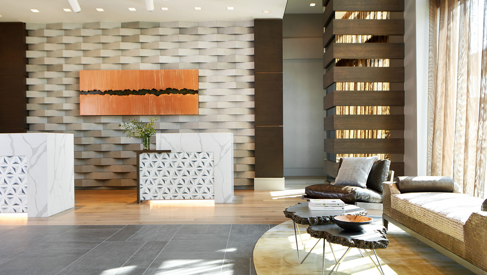 Lobby with tall ceiling and two white desks