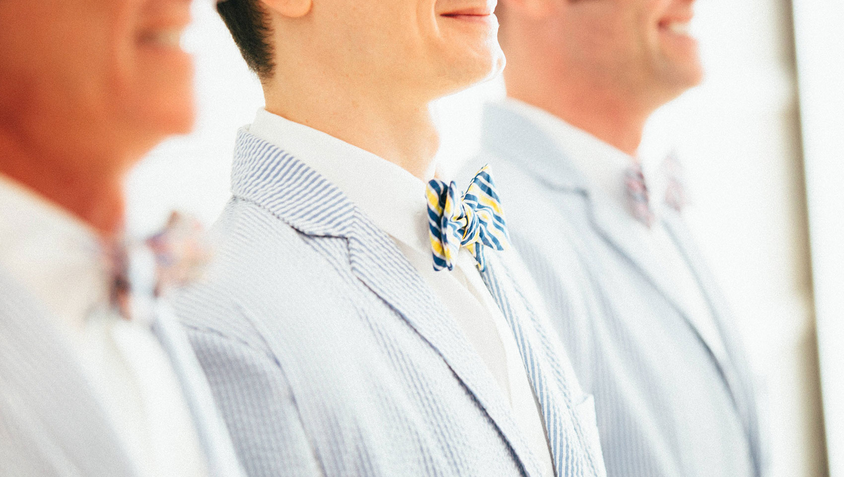 man in blue suit smiling