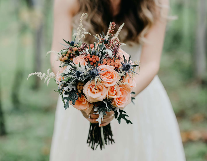 bride holding flowers