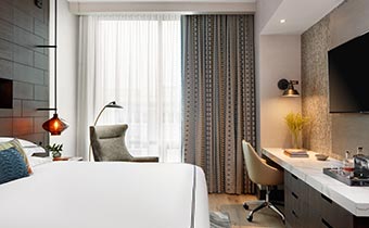 white bed with red lamp