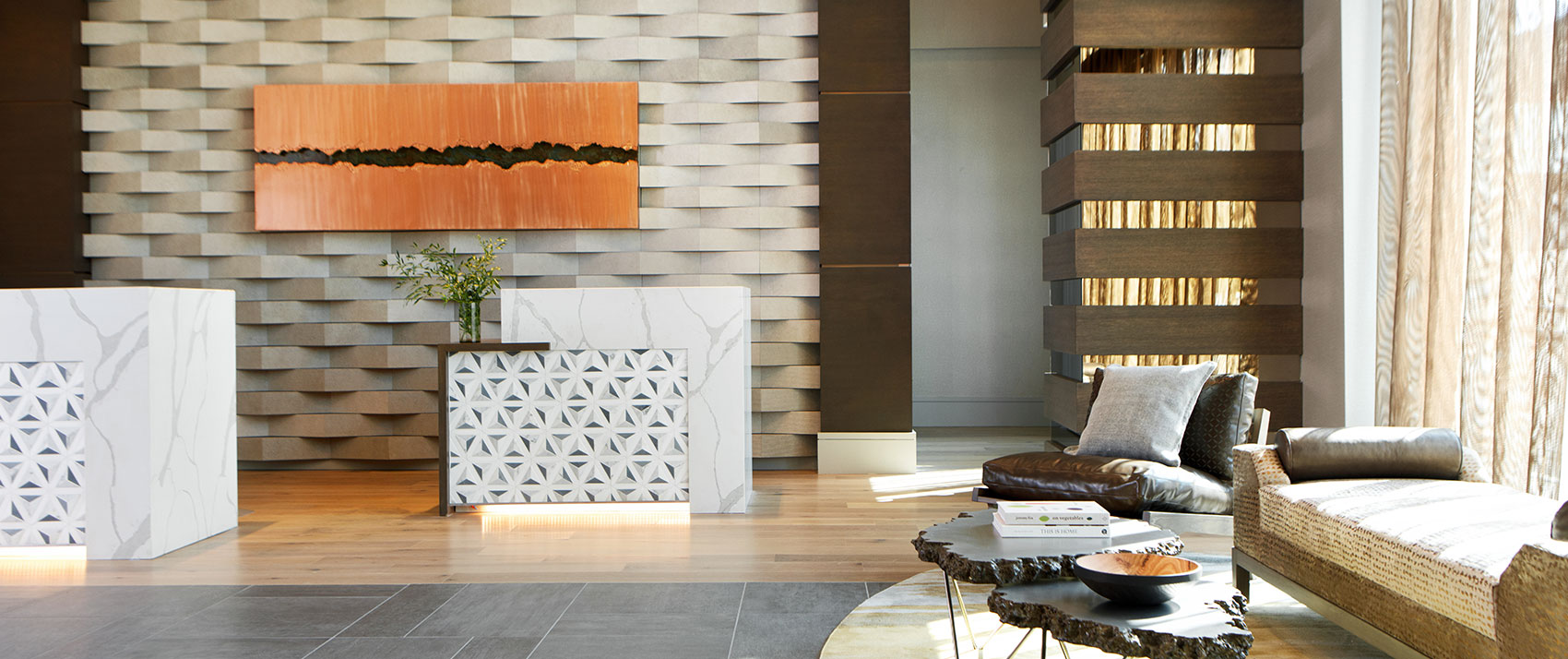 lobby with tall ceilings and white front desk